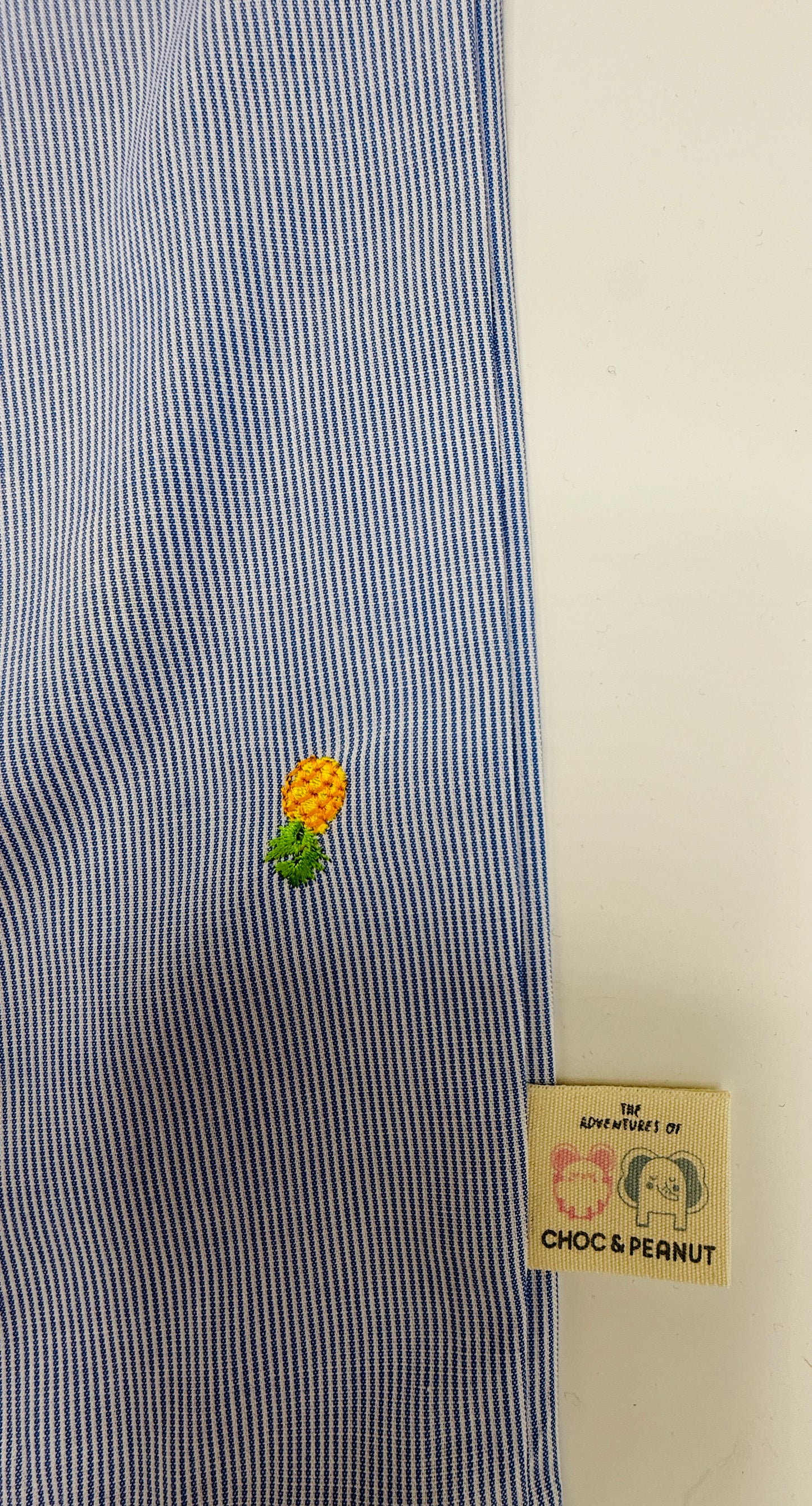 Sustainable cotton Unisex Kids pinstripe trousers with embroidered pineapples