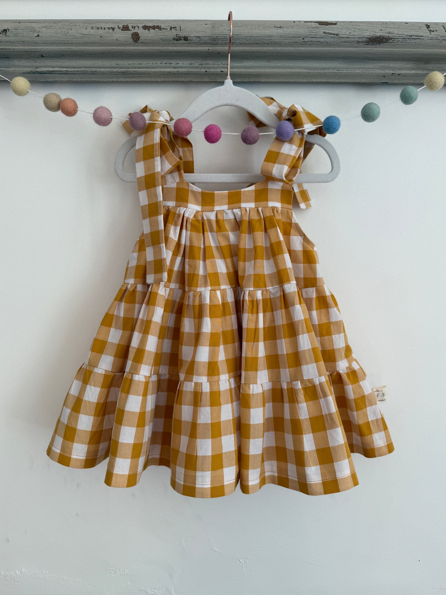 100% Cotton Gingham Mustard tiered dress with bow straps