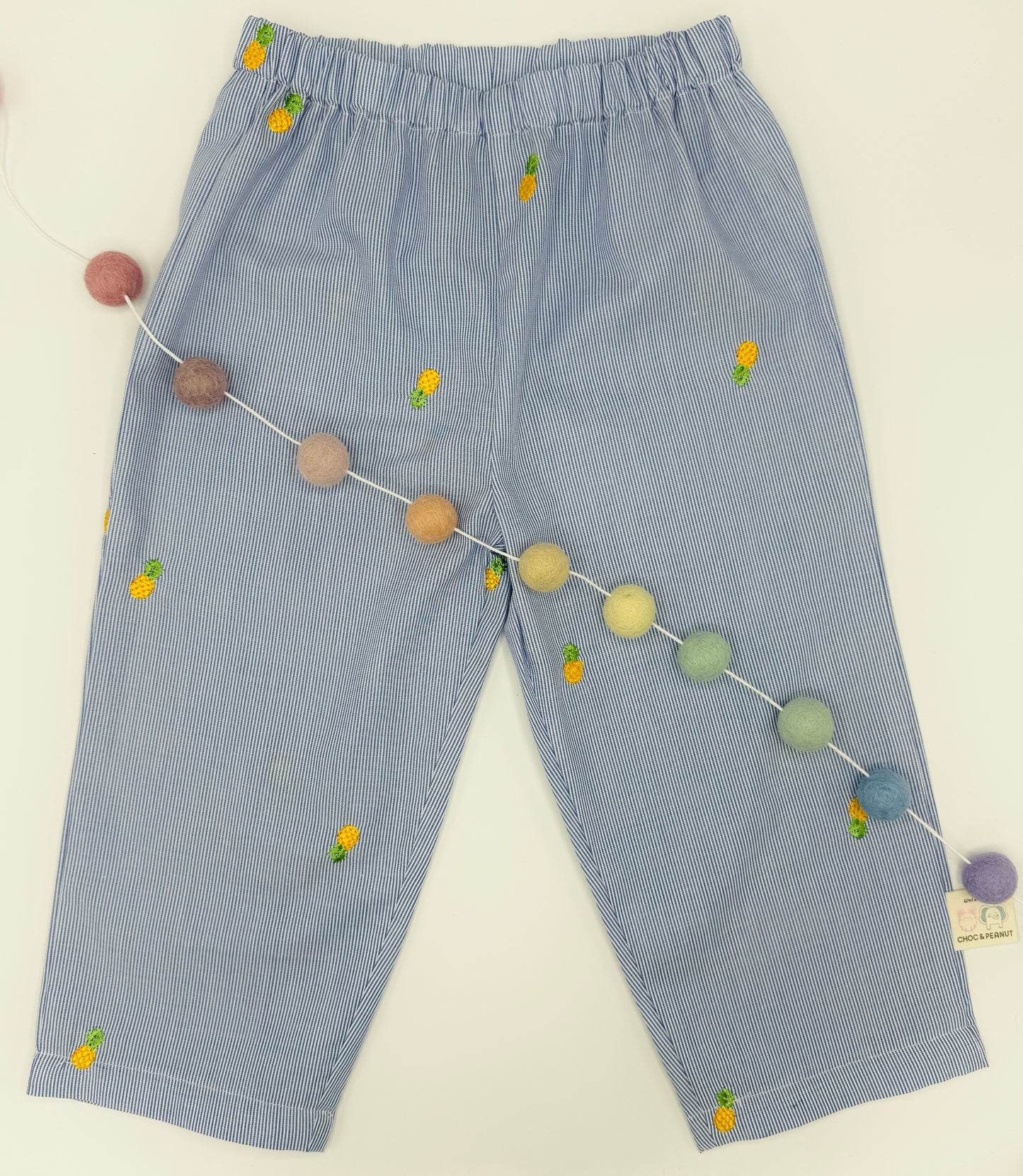Sustainable cotton Unisex Kids pinstripe trousers with embroidered pineapples