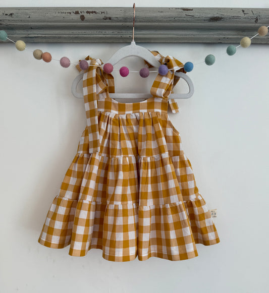 100% Cotton Gingham Mustard tiered dress with bow straps