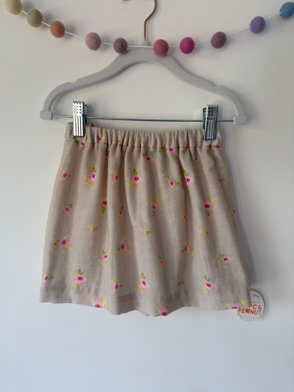 Rosebud pattern on a natural background. 100% cotton muslin skirt with elasticated waist for toddlers & children.