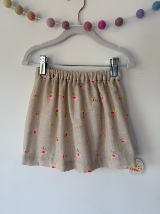 Rosebud pattern on a natural background. 100% cotton muslin skirt with elasticated waist for toddlers & children.