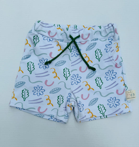 Unisex shorts with floral and line detail in pastel colours. Sustainable fabric.
