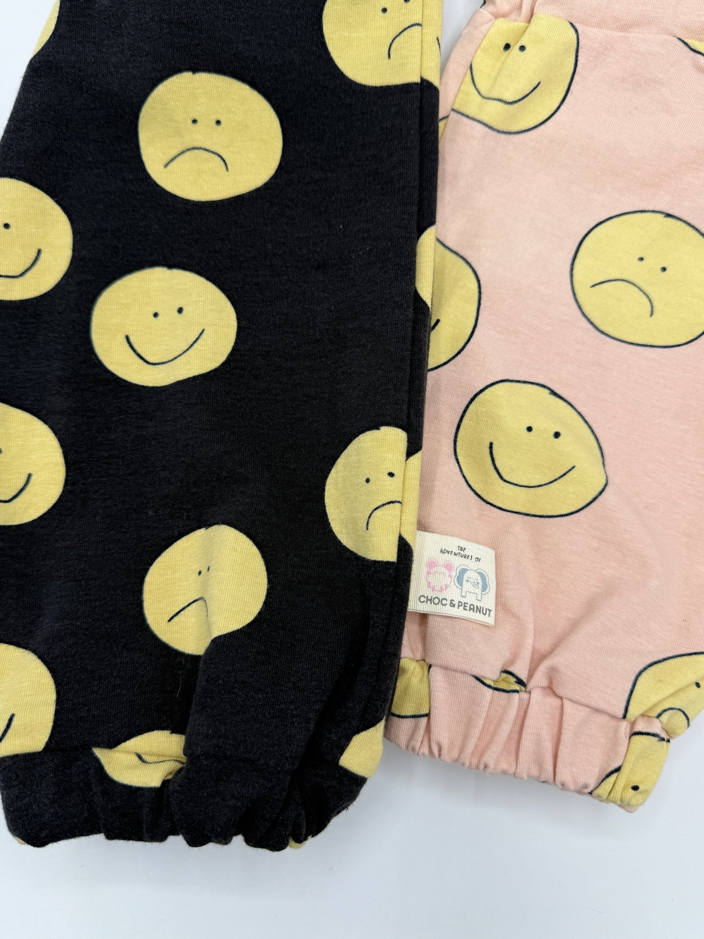Black sustainable Unisex Kids Sweatpants with happy/sad faces