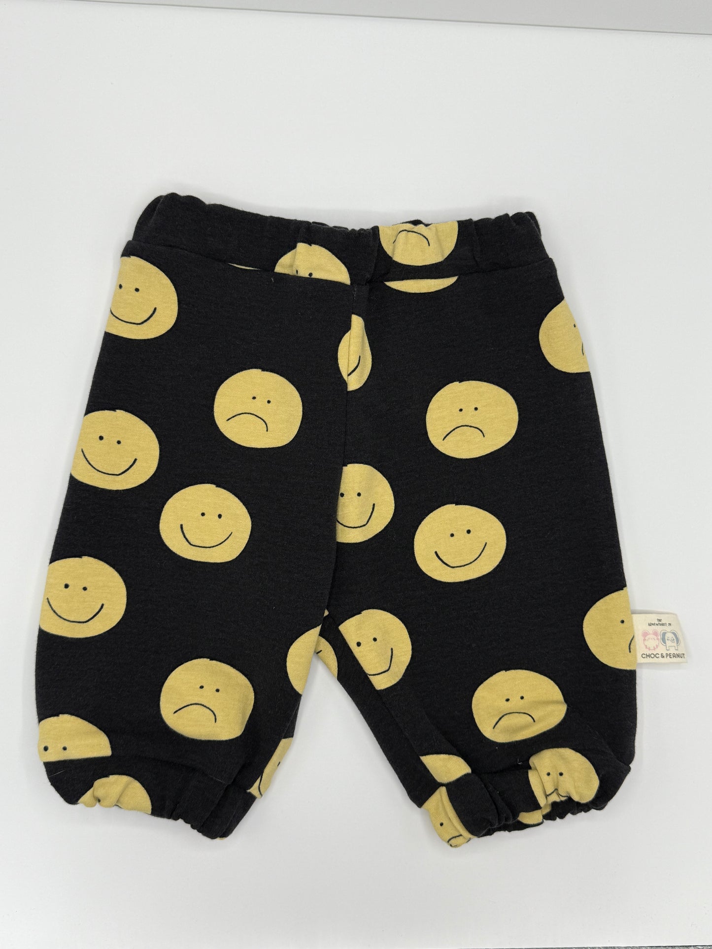 Black sustainable Unisex Kids Sweatpants with happy/sad faces