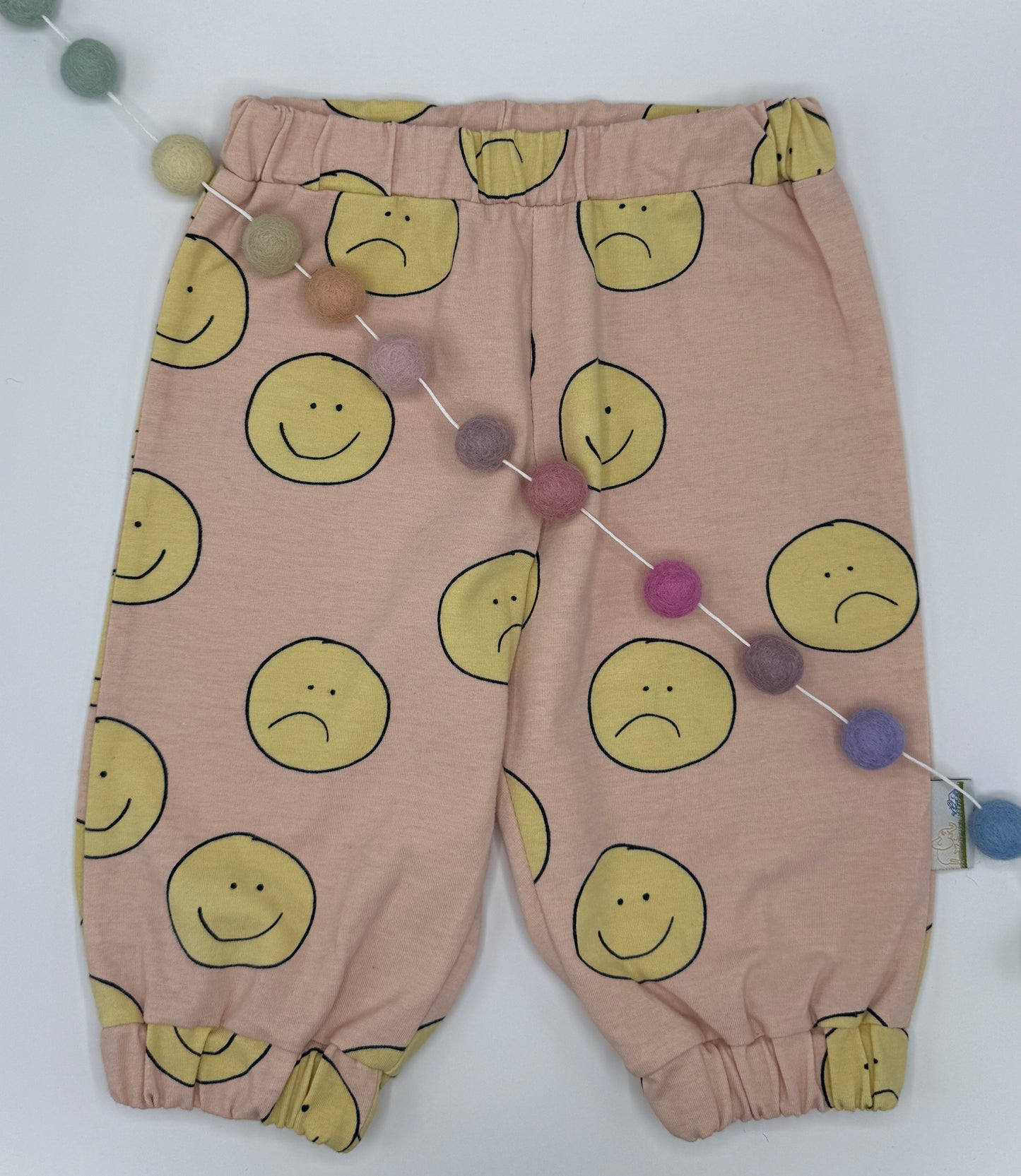 Pink sustainable Unisex Kids Sweatpants with happy/sad faces